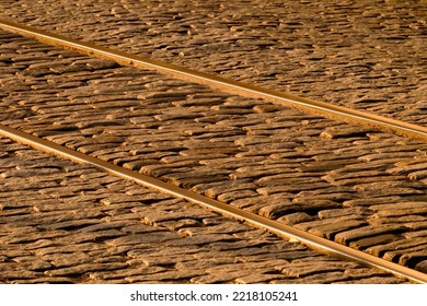 USA, Georgia, Savannah. Old Railroad Tracks Along Cobblestone At River Street.