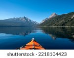 USA, Idaho, Redfish Lake. Kayak facing Sawtooth Mountains.