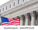 USA national flag waving in the wind in front of United States Court House in New York