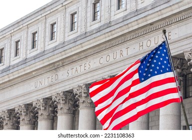 USA national flag waving in the wind in front of United States Court House in New York - Shutterstock ID 2231108363