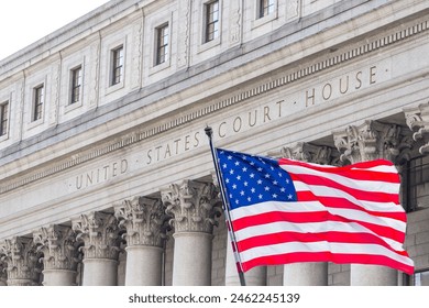 USA national flag waving in the wind in front of United States Court House in New York