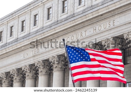 USA national flag waving in the wind in front of United States Court House in New York