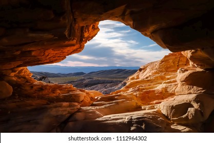 USA, Nevada, Clark County, Gold Butte National Monumnet: Picture Window Cave That Hikers Must Crawl Through On The Trail To Failing Man Petroglyph.