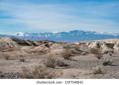 USA, Nevada, Clark County, Tule Springs Fossil Beds National Monument: White Gypsum Hills With Mt. Charleston In The Distance.