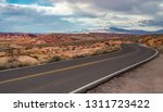 USA, Nevada, Clark County, Valley of Fire State Park. A road curves through the mountains outside Las Vegas.