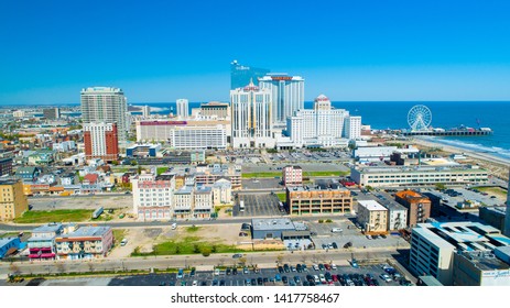USA. NEW JERSEY. ATLANTIC CITY. JUNE 2019: AERIAL VIEW OF ATLANTIC CITY BOARDWALK AND STEEL PIER. 