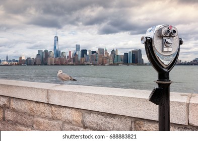 USA, New Jersey, View on Manhattan skyline from Ellis Island, Binoculars in foreground