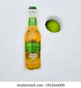 USA, New York - 8 February  2021: Beer Bud Light Lime On The Snow. Close Up View.