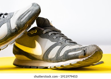 USA, New York Febryary 2021: Old Nike Sneakers. Sports Shoes For Running. Battered Old Sneakers. Sneakers After Years Of Running