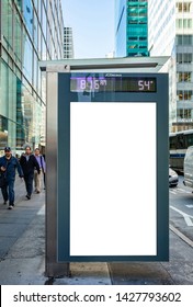 USA, New York May 6, 2019. Vertical Blank White Billboard Mockup For Advertising, Bus Stop At City Buildings And Street Background