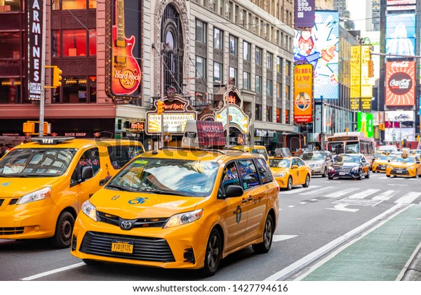 USA, New York, Times square. May 3, 2019.\
Broadway streets. High buildings, colorful neon lights, large\
commercial ads, cars and\
traffic