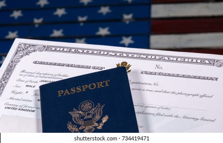 USA Passport And Naturalization Certificate Of Citizenship Over Background Of A Wooden US Stars And Stripes Flag