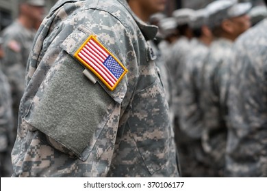 USA patch flag on soldiers arm - Shutterstock ID 370106177