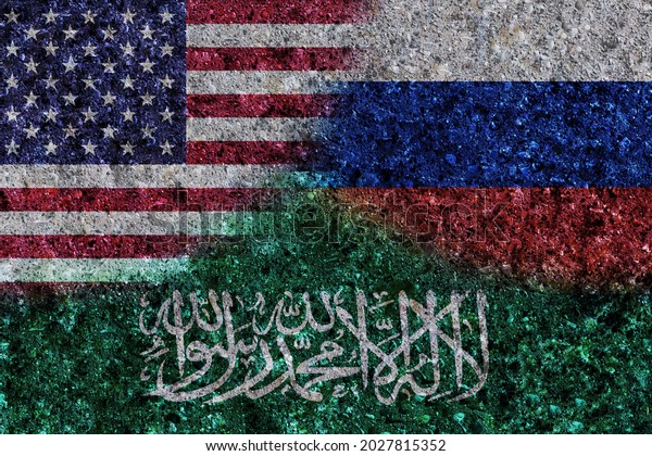 USA, Russia and Saudi Arabia painted flags on a\
wall with grunge texture