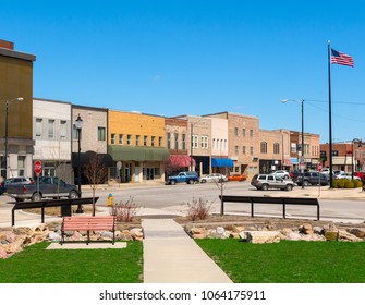 USA Small Town Main Street Business Storefronts With American Flag