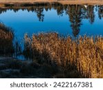 USA, State of Utah. Garfield County. An Indian teepee mirrored in a lake near Bryce.