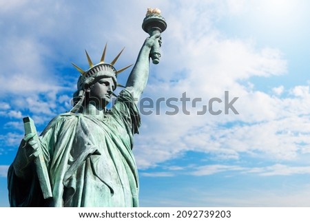 USA Statue of Liberty on sky background. Close-up of New York Statue of Liberty. Monument of woman with torch in new york. USA freedom and democracy symbol. Landmarks of America. Foto d'archivio © 