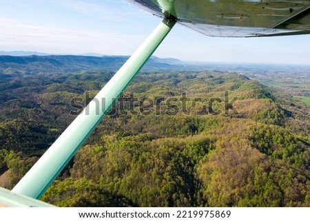 USA, Tennessee. Airplane wing and strut frame view Appalachian Mts and foothills