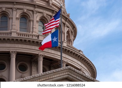 USA and Texas flags on Texas State Capitol - Austin, Texas