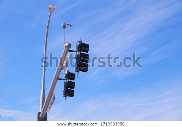 USA. Traffic lights at the\
intersection of streets in the city. Mounted traffic monitoring\
system.