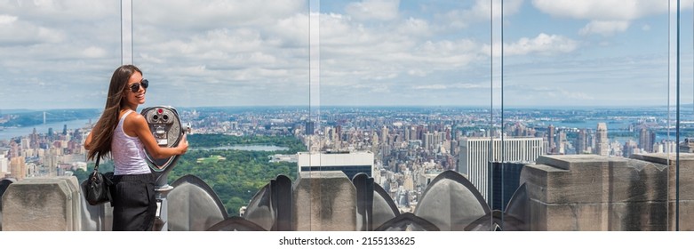 USA Travel Tourist In New York City Vacation- Woman Looking At View Of Skyline With Binoculars From Skyscraper. Girl Traveling Summer Holidays United States Road Trip