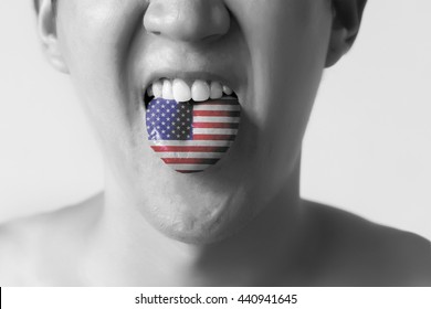 USA Or United States Flag Painted In Tongue Of A Man - Indicating English Language And American Accent Speaking, Study In America Concept In Black And White