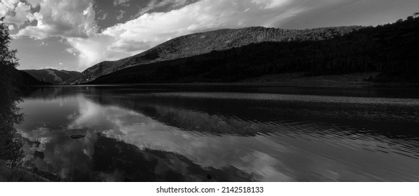 USA, Utah. Black and white panoramic Cloud reflection on Smith Morehouse Reservoir, Uinta-Wasatch-Cache National Forest