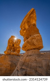 USA, Utah, Devil's Garden Outstanding Natural Area. Sun starburst on hoodoo rock formations. - Shutterstock ID 2314124739