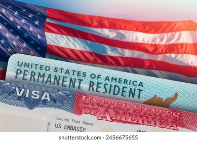 USA VISA and Green Card US Permanent resident. United States of America. Work and Travel ID documents. US Immigrant. Visa for Immigration. Embassy USA. Visa in passport. American flag on background
