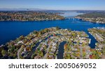 USA, Washington State, Bellevue. Newport Shores neighborhood, Lake Washington and floating bridge in autumn, with Seattle in distance.