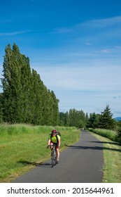 Usa, Washington State, Redmond. Cyclist On Sammamish Slough Trail