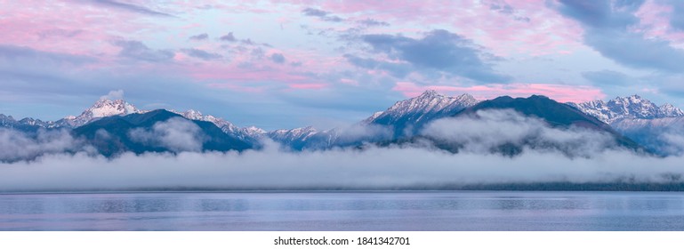 USA, Washington State, Seabeck. Composite of Hood Canal and Olympic Mountains at sunrise.