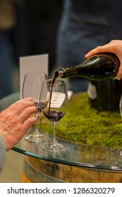 USA, Washington, Woodinville. Wine Pouring Into Glass In Washington Winery.