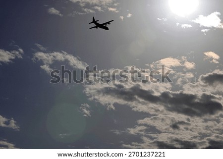 USAF Plane Flying High Through The Clouds