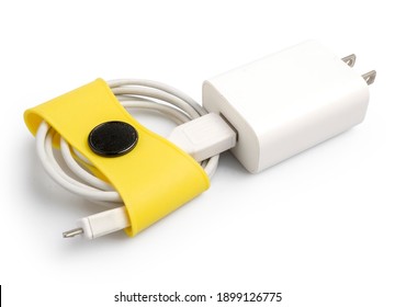 Usage example of multifunctional yellow clip as wire or cord holder. Clipping path