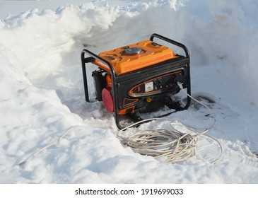 Usage of gasoline portable outdoor generator, home power generator to backup the house during blackouts, outages as a result of a winter storm. 