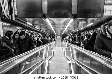 USA/NEW YORK - 3 JAN 2018 - people in the daily life of the New York subway. Climbing Stairs.