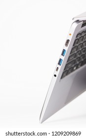 USB 3, USB Type C, HDMI port and DC power socket charging on modern notebook. The exterior is made of durable silver aluminum.