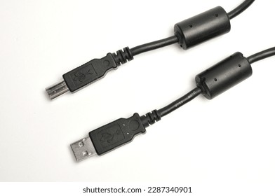 USB A and USB B male printer cable on isolated white background