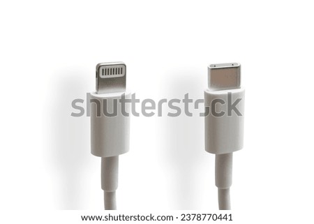 USB C and lightning charging cable on a white background. USB Type C is a universal connector