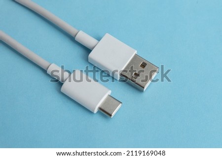 USB cable type C over blue background
