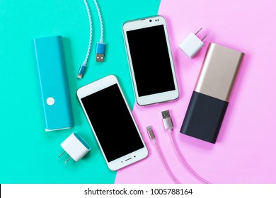 USB charging cables for smartphone and tablet in top view - Shutterstock ID 1005788164