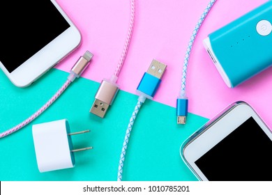 USB charging cables for smartphone and tablet in top view - Shutterstock ID 1010785201
