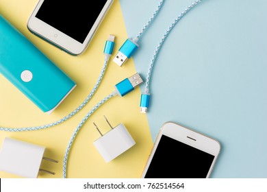 USB charging cables for smartphone and tablet in top view - Shutterstock ID 762514564