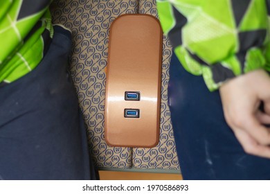 USB charging for gadgets in a modern subway car on a passenger seat in Moscow in Russia.