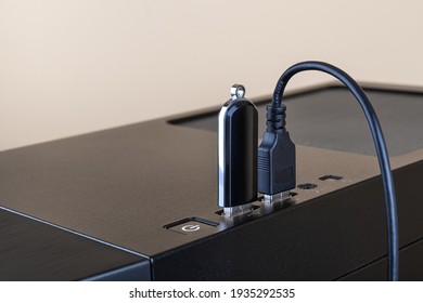 USB Flash Drive And Cable Both Inserted Into Ports On The Top Of A Computer Tower Case. Information Transfer And Storage Device. Universal Serial Bus Standard For PC Cables And Connectors. Copy Space.