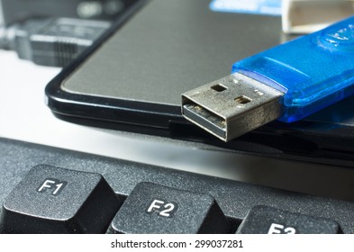 USB flash drive placed on a laptop