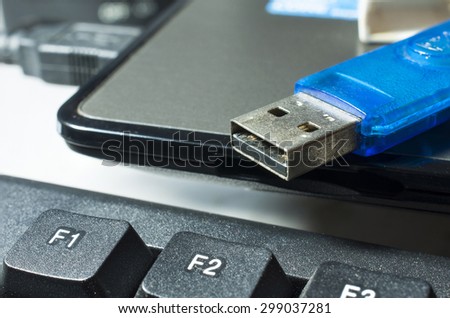 USB flash drive placed on a laptop