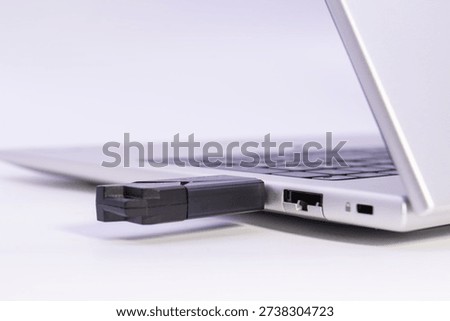 USB flash drive plugged into laptop usb port showing external storage connection