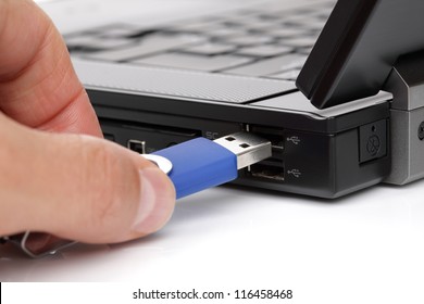 USB Flash Drive Stick Being Connected To Laptop Computer